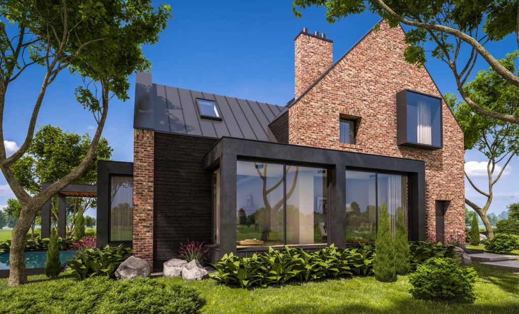 Fertighaus mit Klinkern und moderner Fensterfront in Massivbauweise