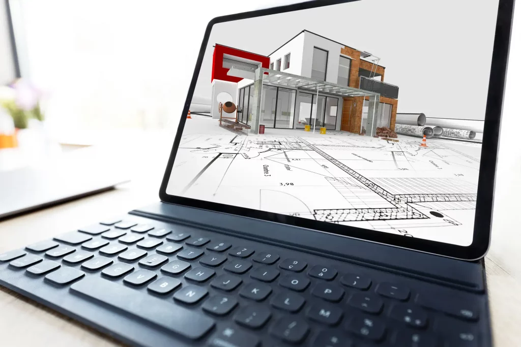 Laptop zeigt ein 3D-Modell eines modernen Hauses mit detaillierten Bauplänen auf dem Bildschirm. Das Bild symbolisiert die digitale Fassadenplanung.