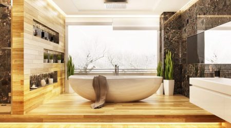 Badezimmer im Winter. Mittig steht eine Badewanne.