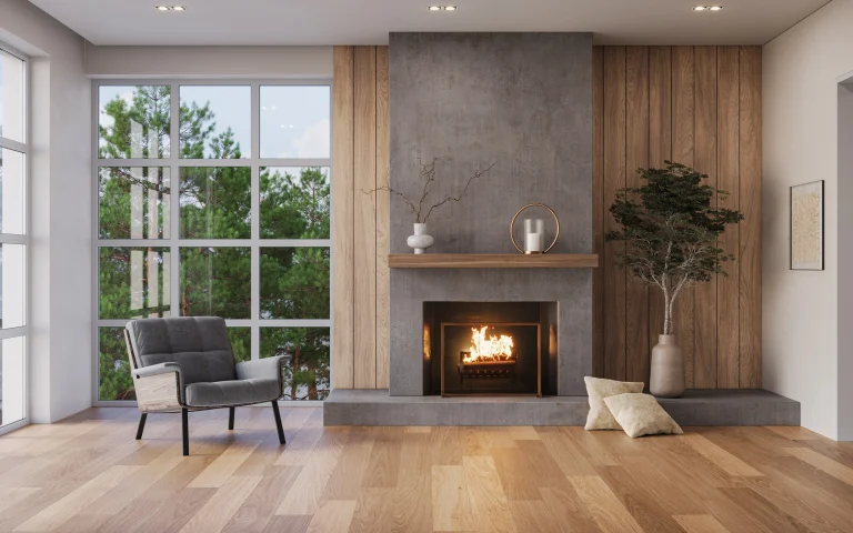 Ein hellgrau eingemauerter Kamin in einem modernen Wohnzimmer.