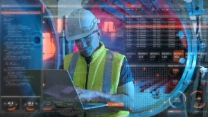 Ein Ingenieur arbeitet an einem Laptop.