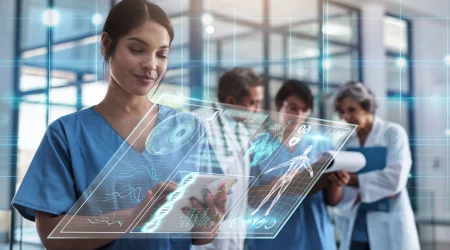 Ärztin in blauer Arbeitskleidung, arbeitet mit neuster Technologie